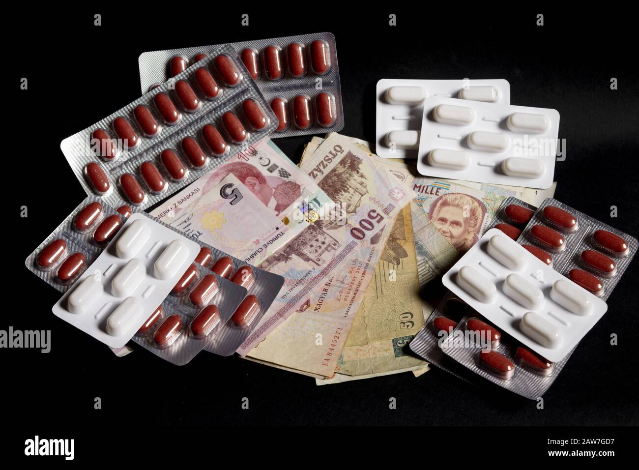 global  health with variety of banknotes and pills blisters Stock Photo