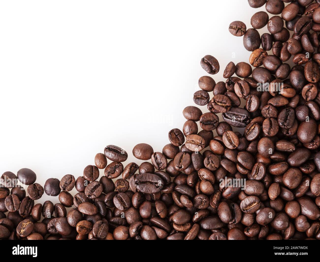 Roasted coffee beans on white background with copy space` Stock Photo ...