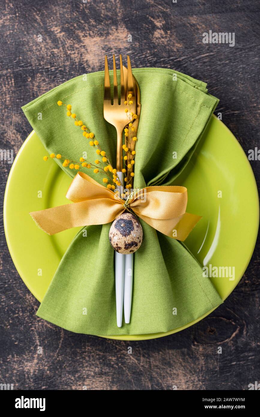 Easter table setting with green plate Stock Photo