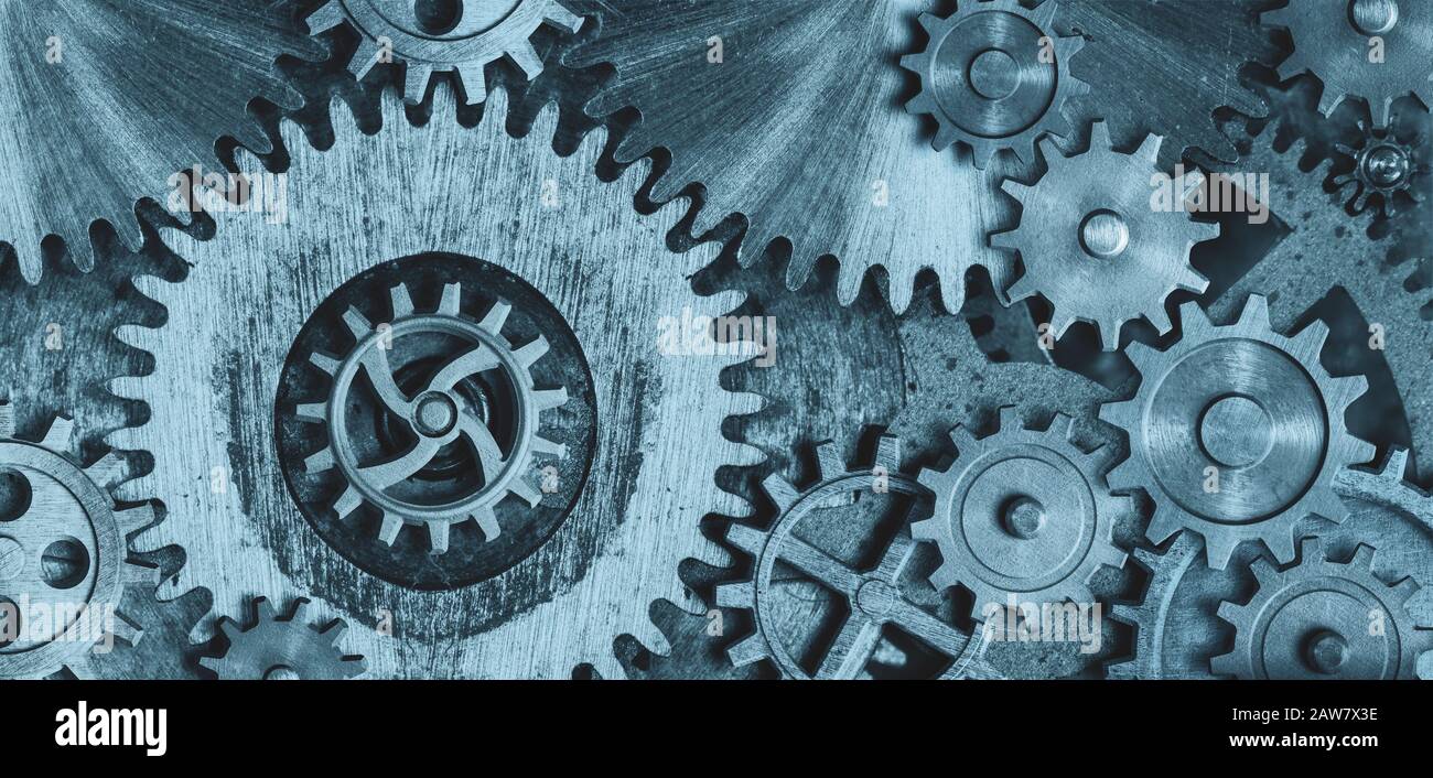 Old gears and cogs clock mechanism. Toned blue Stock Photo - Alamy