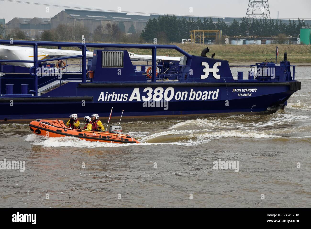 Broughton, Flintshire, North Wales, UK. 7th February 2020. The final A380 wing leaves the Airbus factory. The Dee River Craft Afon Dyfrdwy travels on the River Dee to the Port of Mostyn where the wing will then be shipped to Toulouse in France for final assembly. The customer for the last A380 is Emirates. Credit: Andrew Paterson/Alamy Live News Stock Photo