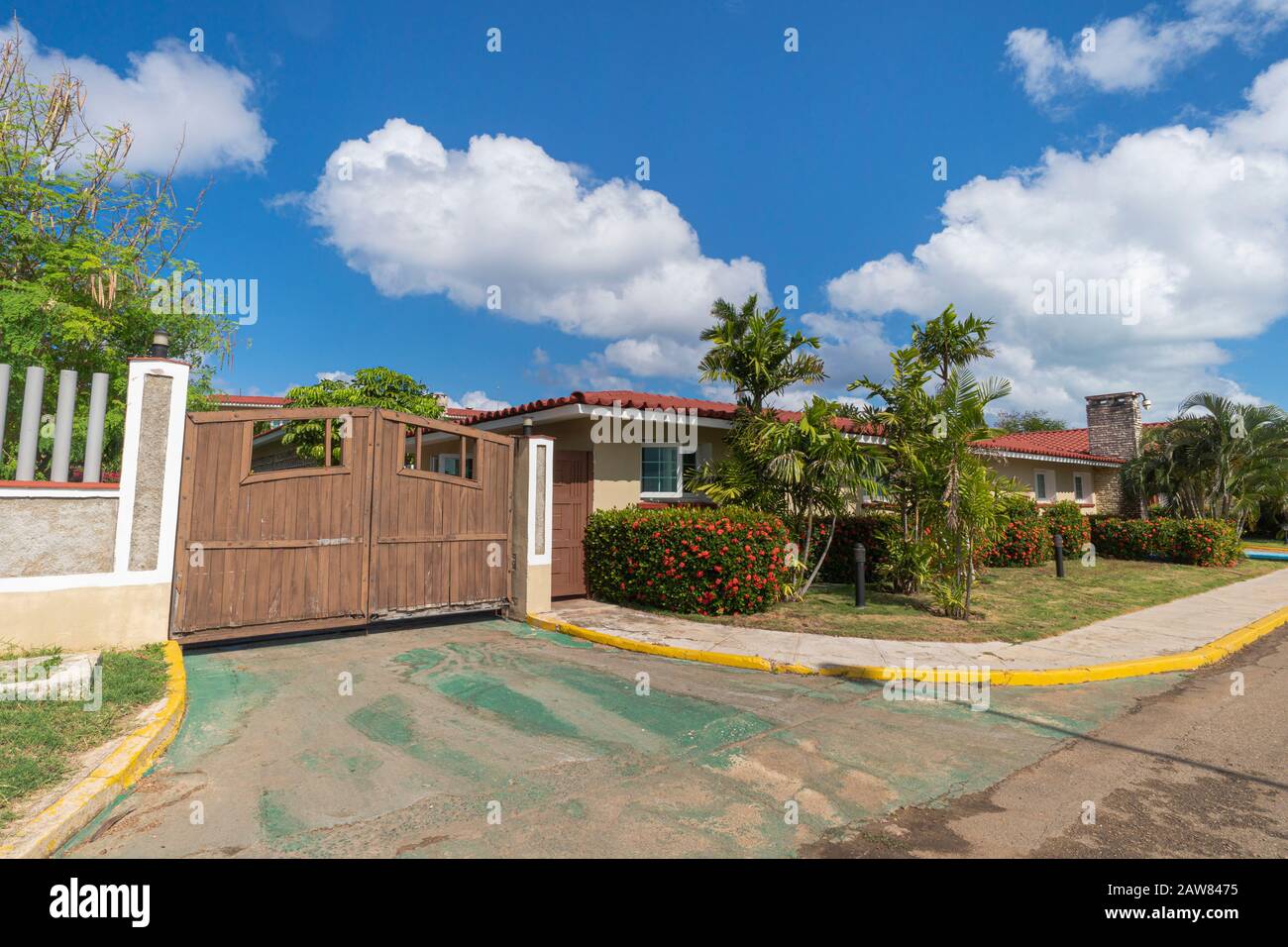 Gate of the house. wooden gates for entering cars in front of a single-storey house. Traditional dwellings in Latin America Stock Photo