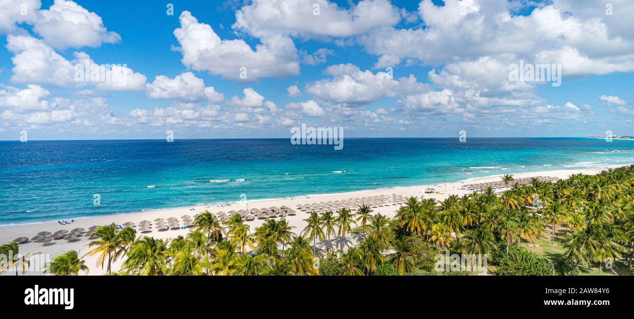 Top view of the Caribbean dream beach in Varadero Cuba with sun lounger and thatched huts. Panoramic view of the 20 km long beach of the resort town o Stock Photo