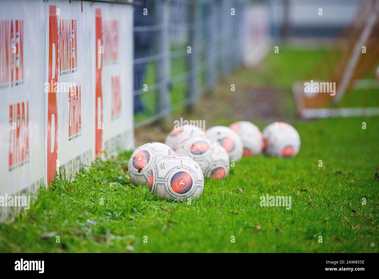Soccer balls on the sidelines of the field Stock Photo