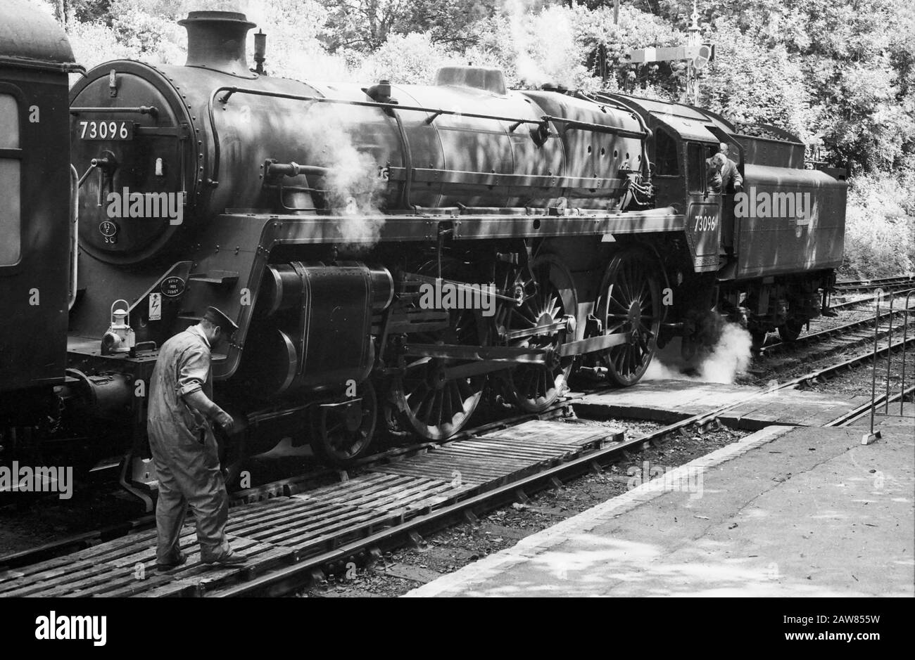 Mid-Hants Railway (The Watercress Line), Hampshire, UK: steam locomotive 73096 BR Standard Class 5 4-6-0 No.3 ready to run from Alresford Station.  Black and white film photograph, circa 1996 Stock Photo