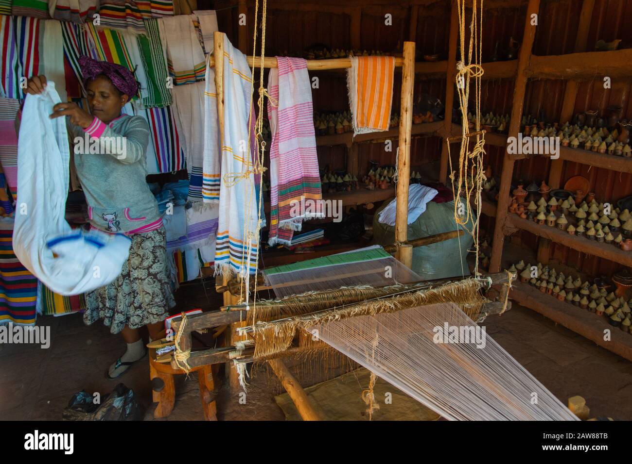 Lalibela, Ethiopia Nov 2018 Ethiopian woman weaving colorful scarves