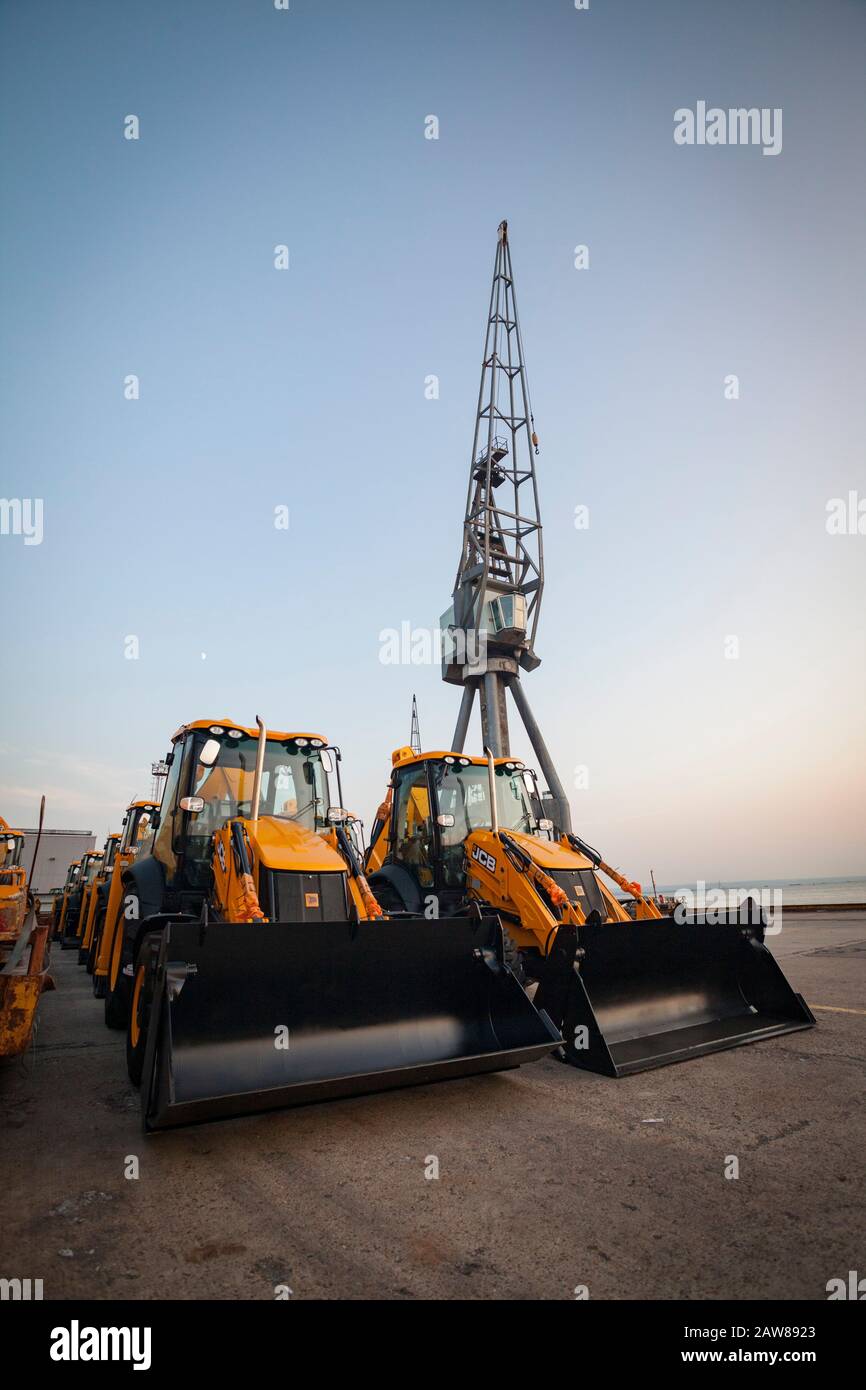 JCB diggers waiting to be exported Stock Photo