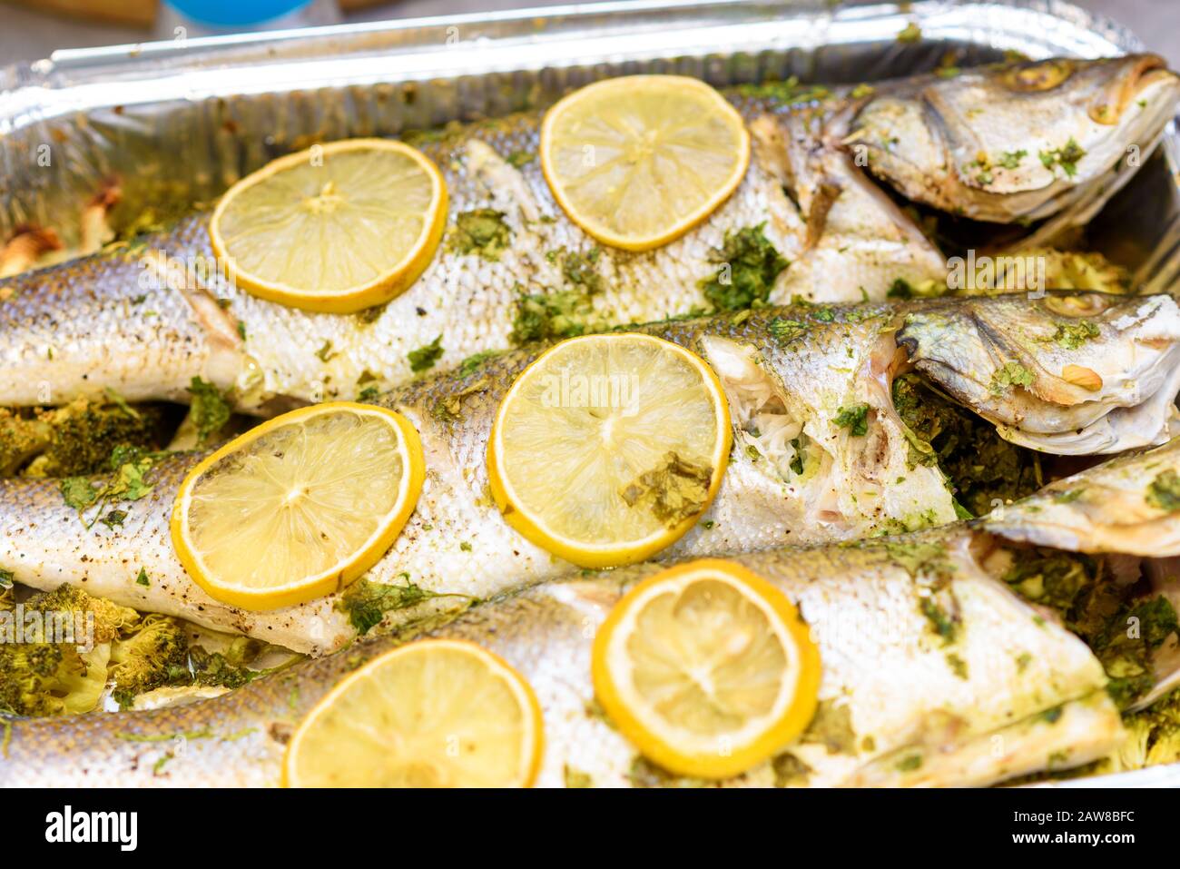 Whole roasted sea bass. Oven baked whole fish with lemon, herbs and