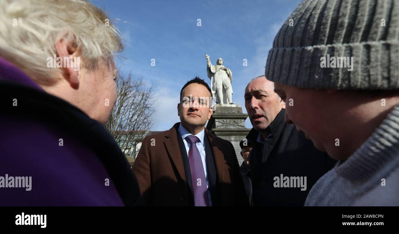 Tullow, Carlow, Ireland. 6/February/2020 Irish General Election. Under the shadow of the statue of 1798 hero Father Murphy, Taoiseach and Fine Gael leader Leo Varadkar, and local candidate Pat Deering, listen to the compaints of two local constituents regarding the health service during a canvass of Tulow in County Carlow. Photo: Eamonn Farrell/RollingNews.ie/Alamy Live News Stock Photo