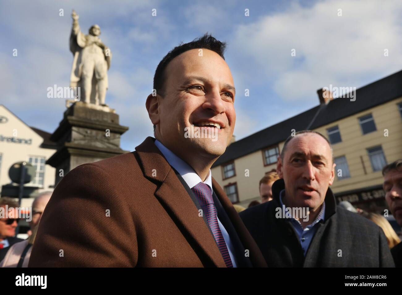Tullow, Carlow, Ireland. 6/February/2020 General Election. Left to right. Taoiseach and Fine Gael leader Leo Varadkar, and local candidate Pat Deering, with the statue of 1798 hero Father Murphy in the background, during a canvass of Tulow in County Carlow. Photo: Eamonn Farrell/RollingNews.ie/Alamy Live News Stock Photo