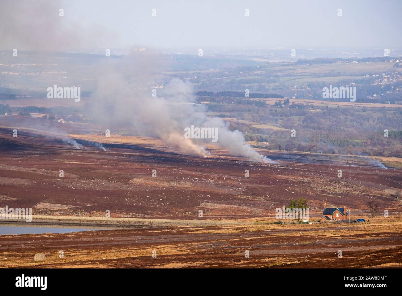 Air pollution from land management - smoke and burning heather in County Durham moorland. Fire used in order to manage grouse moors. Stock Photo