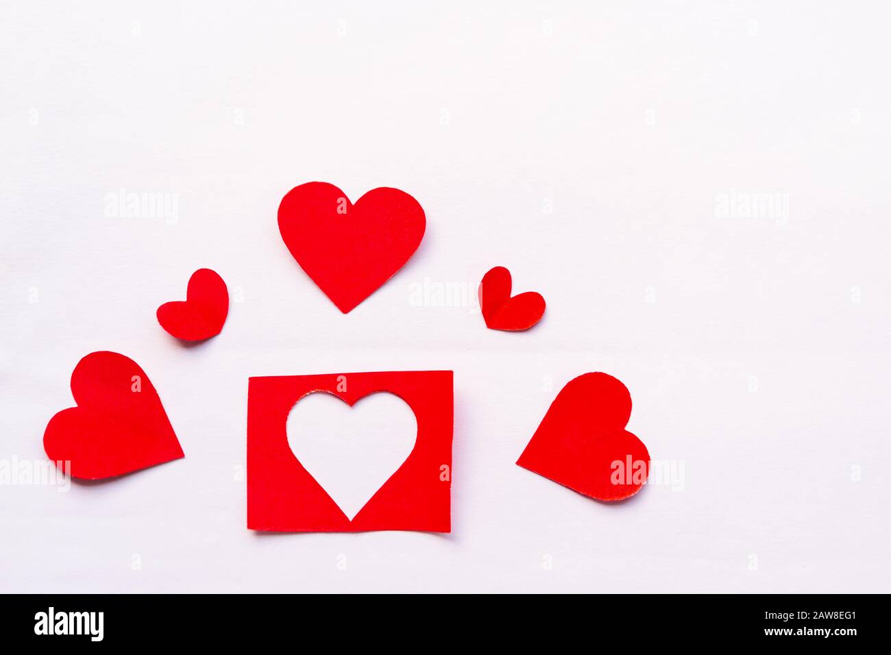 Valentines day wallpaper. Hand crafted red paper hearts isolated on ...