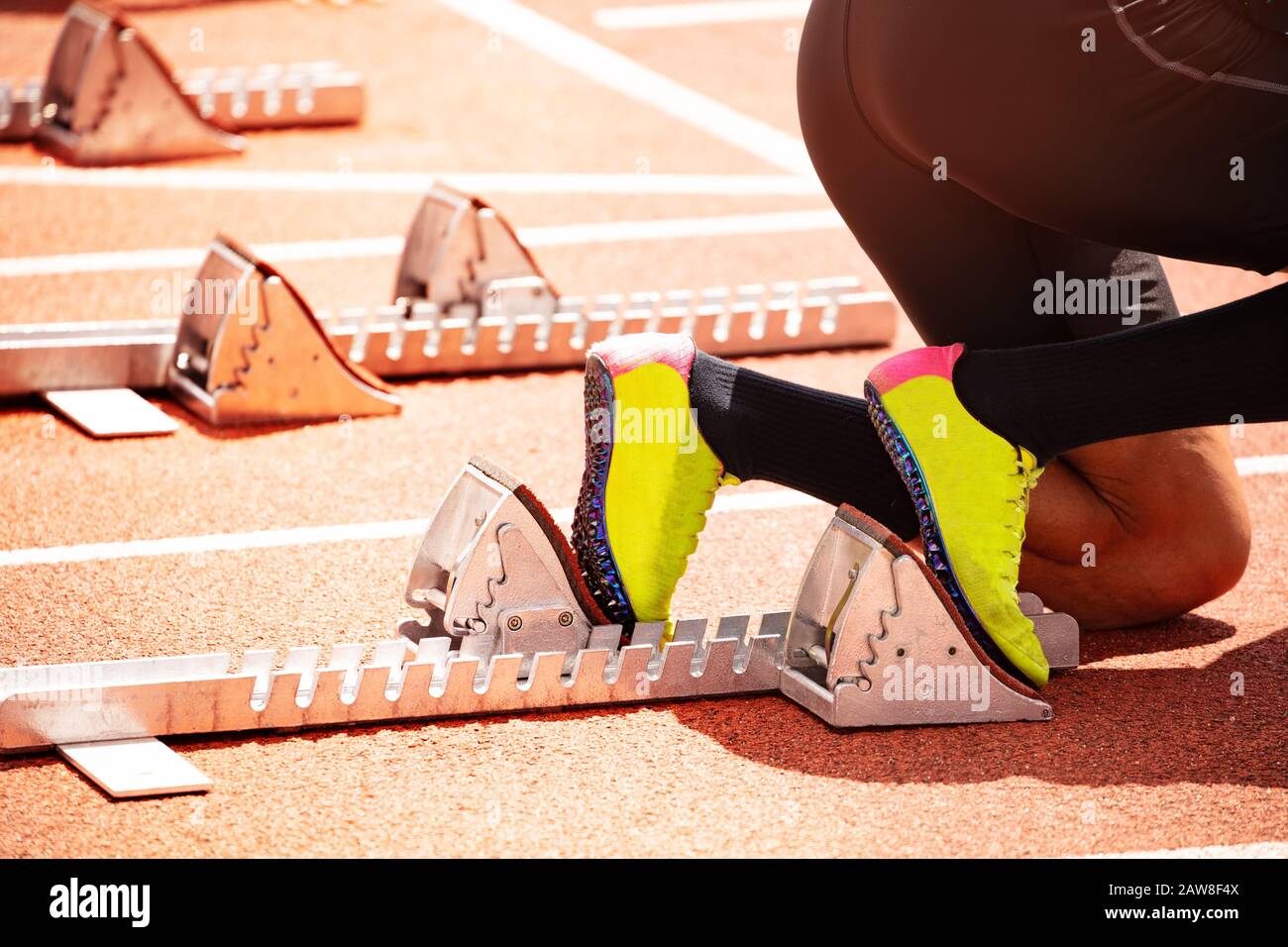 Close-up of shoes and start track before running sprint on stadium sport competition Stock Photo