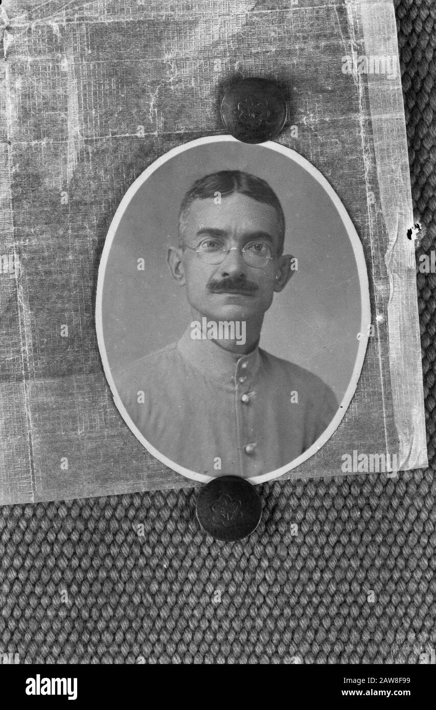 [Oval photo portrait of a man with glasses and mustache dressed in old colonial uniform] Annotation: Repro Negative Date: 01/01/1947 Location: Indonesia, Dutch East Indies Stock Photo