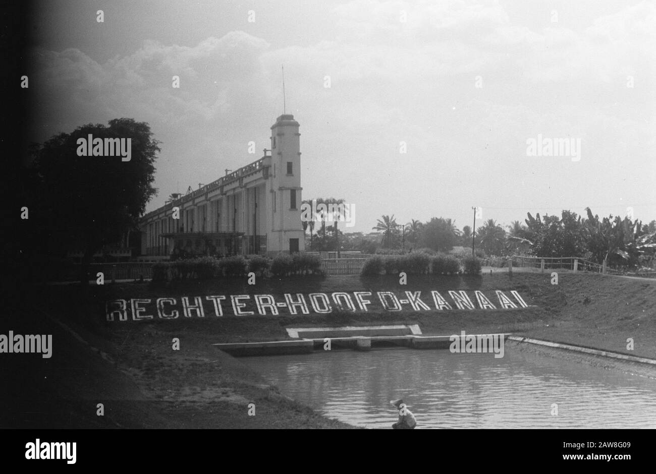 On a slope above a water passage in large letters the word Right main channel Date: 01/01/1949 Location: Indonesia, Dutch India Stock Photo