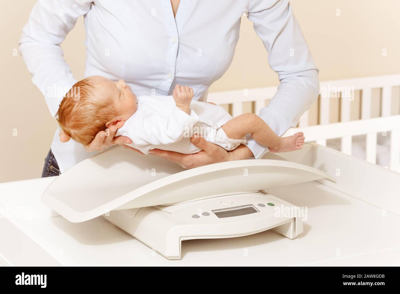 Nurse weighing baby hires stock photography and images Alamy