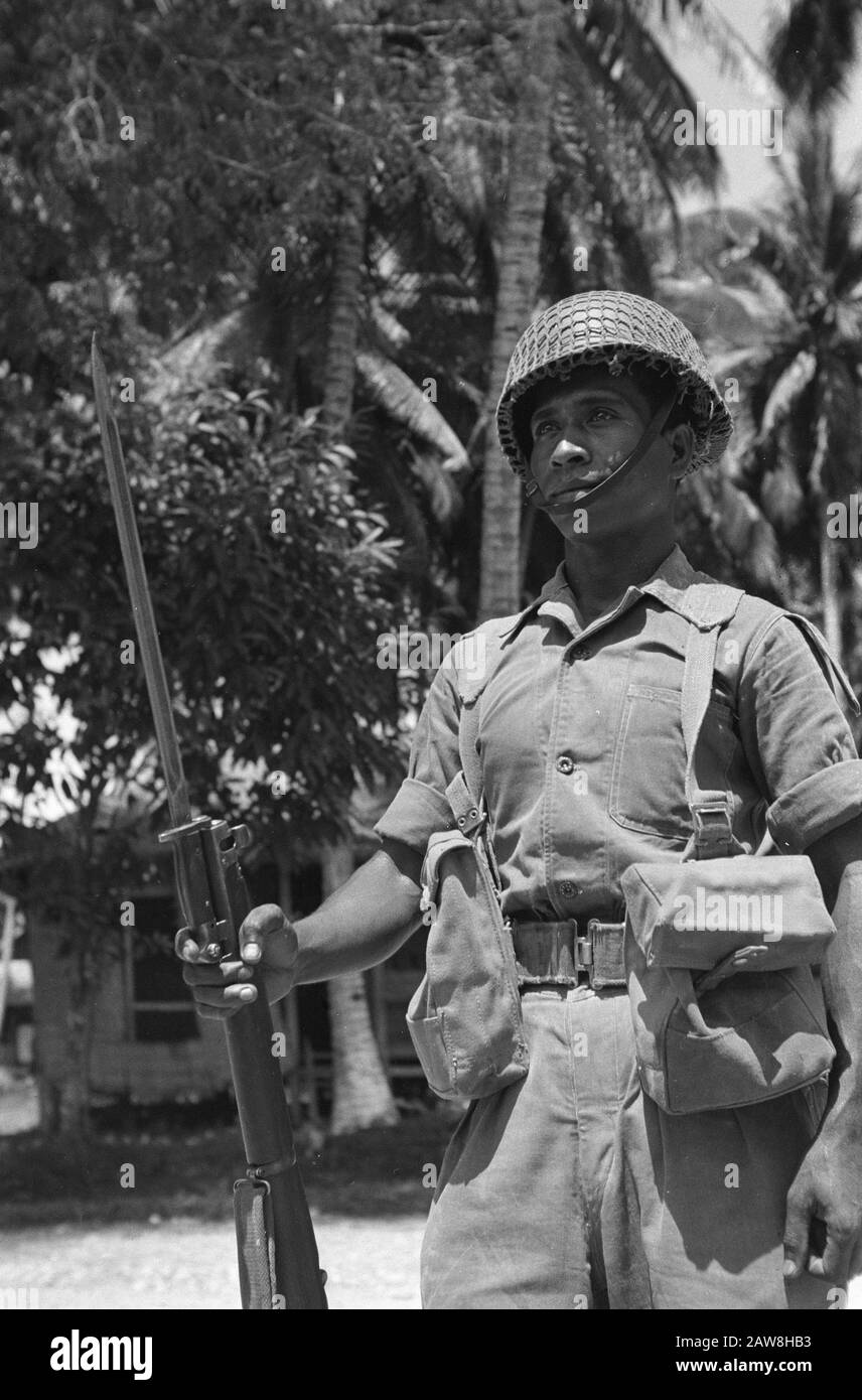 Masamba affair  KNIL soldier stands guard with bayonet on rifle Annotation: Mambasa affair = Resistance or gang led by a female councilor from Makassar (Salawati Daud or Lot Salawati) kidnapped and murdered a Dutch representative of a cigarette manufacturer Th. Pluyters They also attacked a police station and were taking weapons loot. Later, they staged a raid on a prison and freed the prisoners. Date: November 1949 Location: Sulawesi, Indonesia, Masamba, Dutch East Indies Stock Photo
