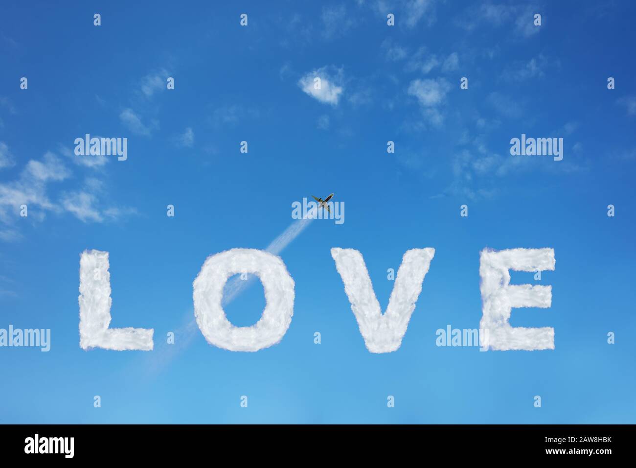 Love sign made of clouds letters over blue sky with flying away jet