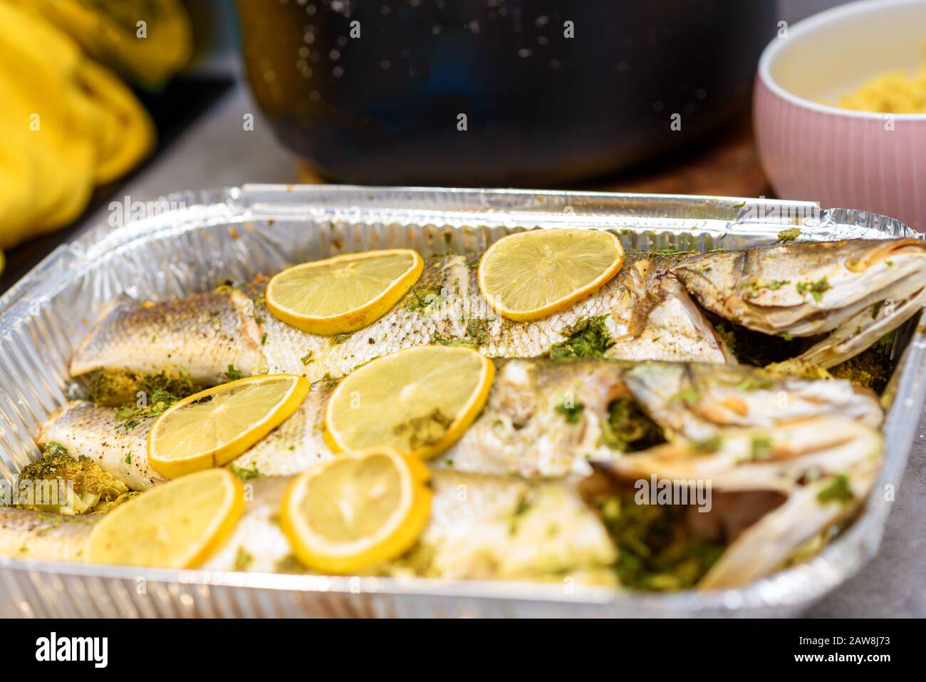 Whole roasted sea bass. Oven baked whole fish with lemon, herbs and