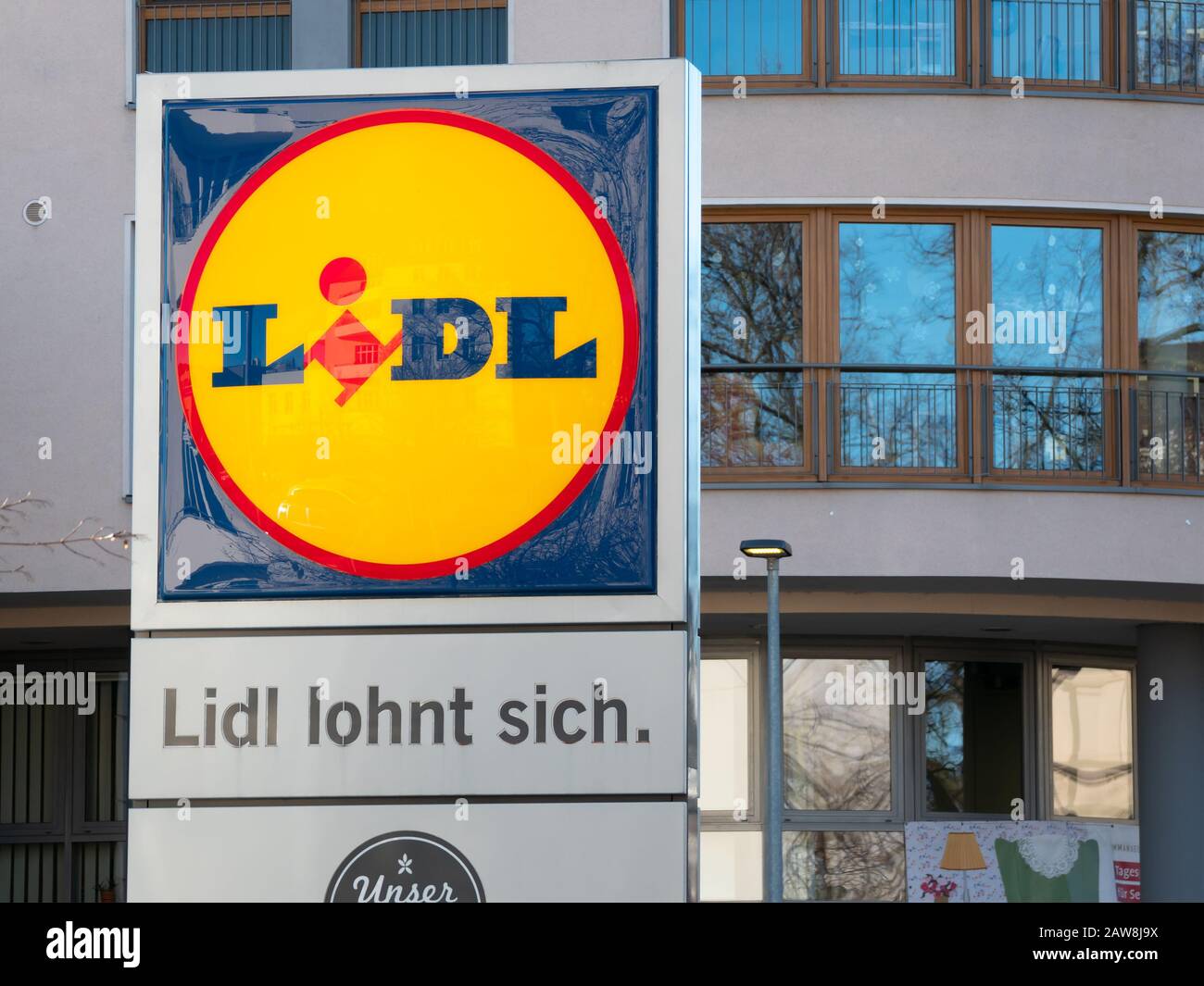 BERLIN, GERMANY - FEBRUARY 4, 2020: Lidl Logo And Slogan At A Supermarket in Berlin, Germany Stock Photo