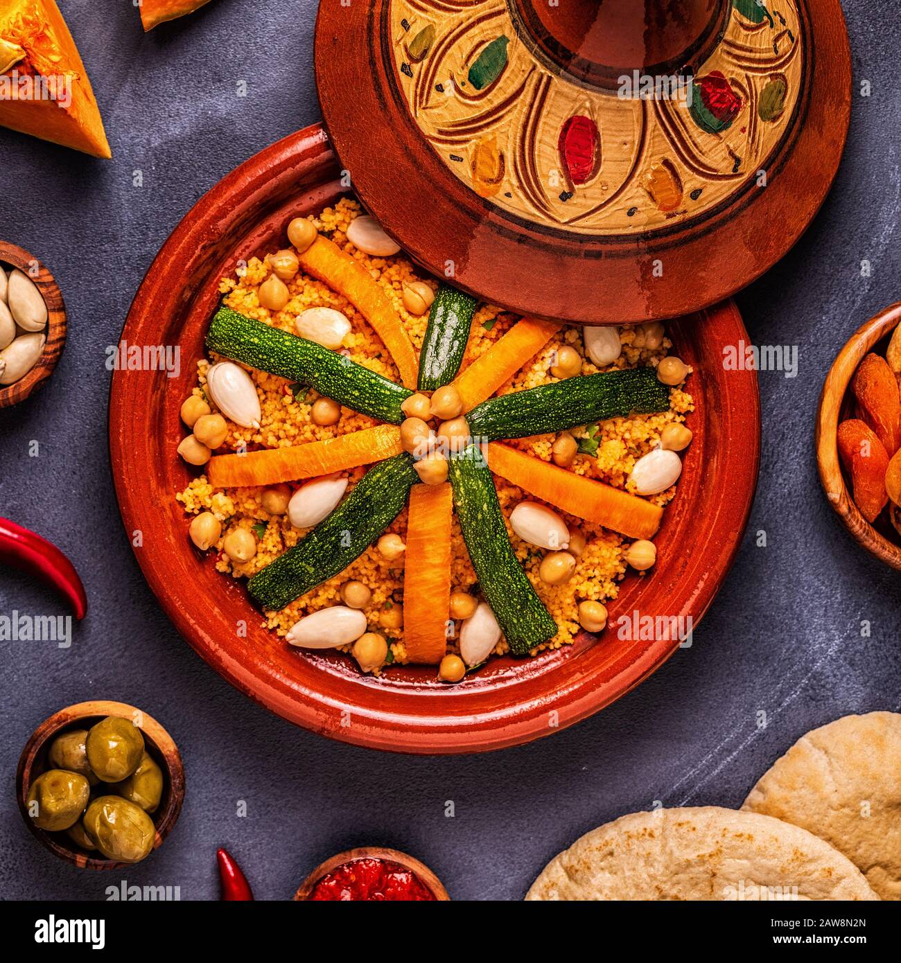 Vegetable tagine with almond and chickpea couscous, top view Stock