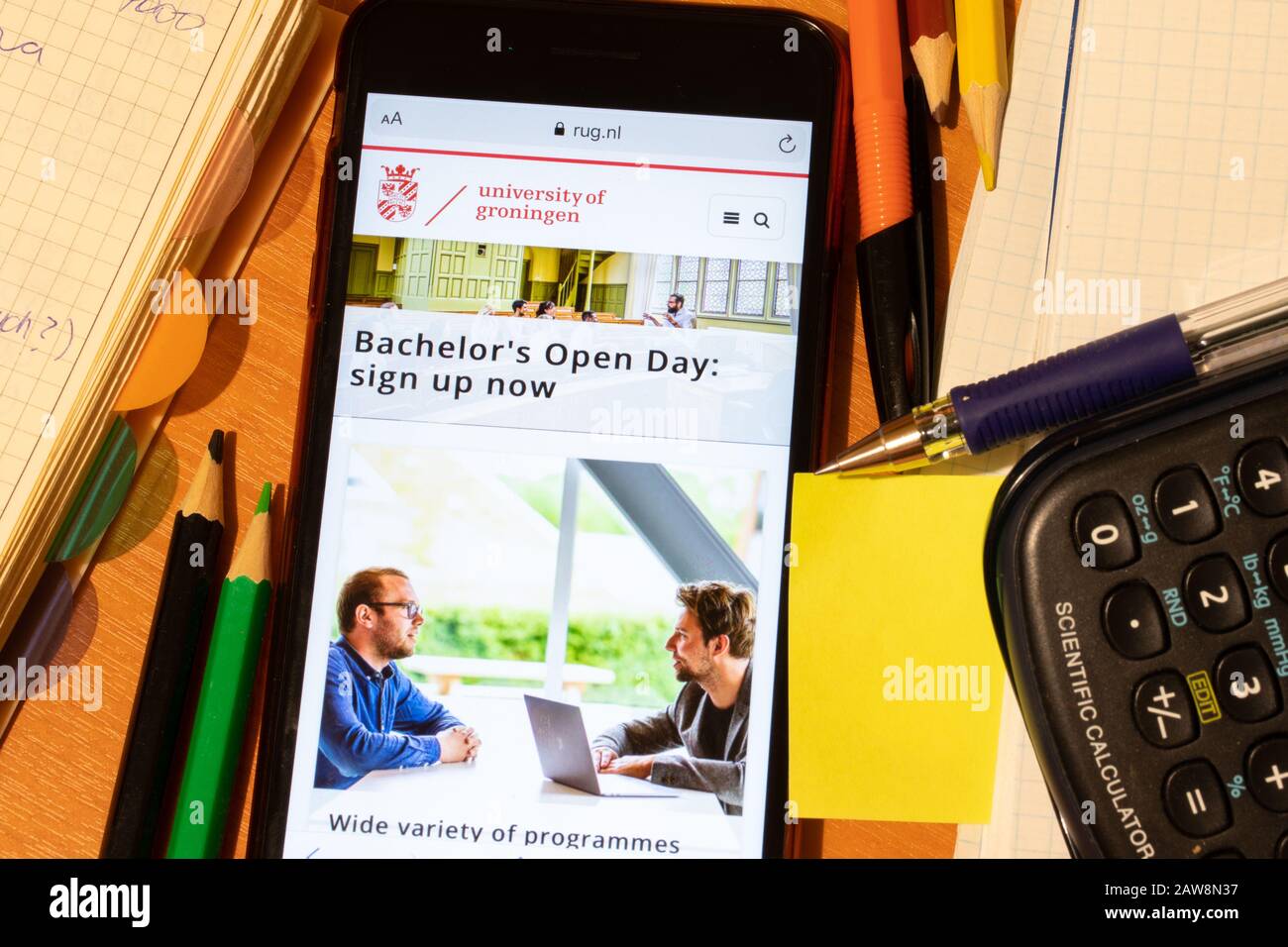 Saint-Petersburg, Russia - 10 January 2020: Phone screen with University of Groningen website page. Higher education admission concept, Illustrative Stock Photo