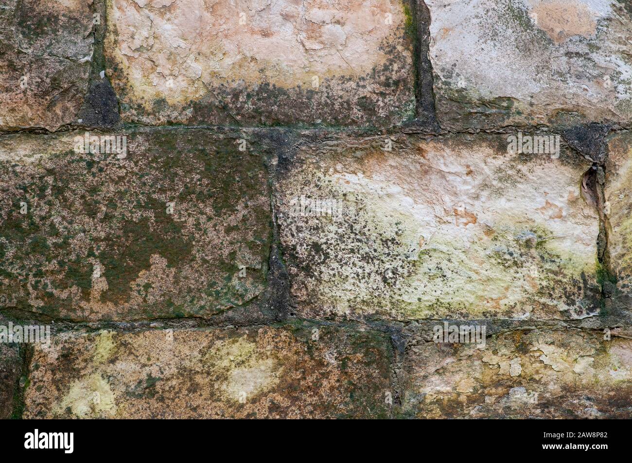 Close up of an old unkempt stone wall of an old templer building in Beit Lehem Haglilit, Israel. Bethlehem of the Galilee is a small community located Stock Photo