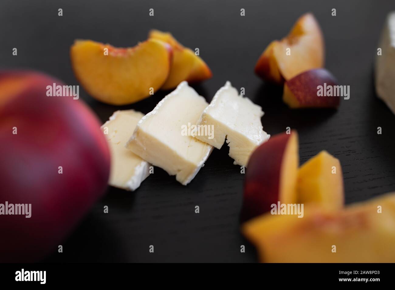 Combination of Brie french cheese and peach Stock Photo Alamy