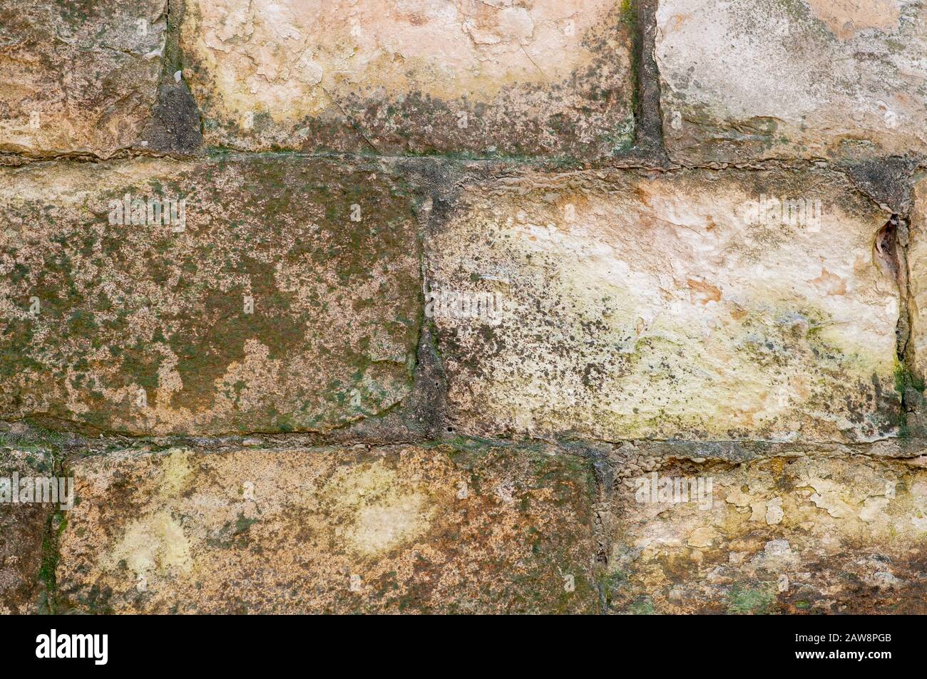 Close up of an old unkempt stone wall of an old templer building in Beit Lehem Haglilit, Israel. Bethlehem of the Galilee is a small community located Stock Photo