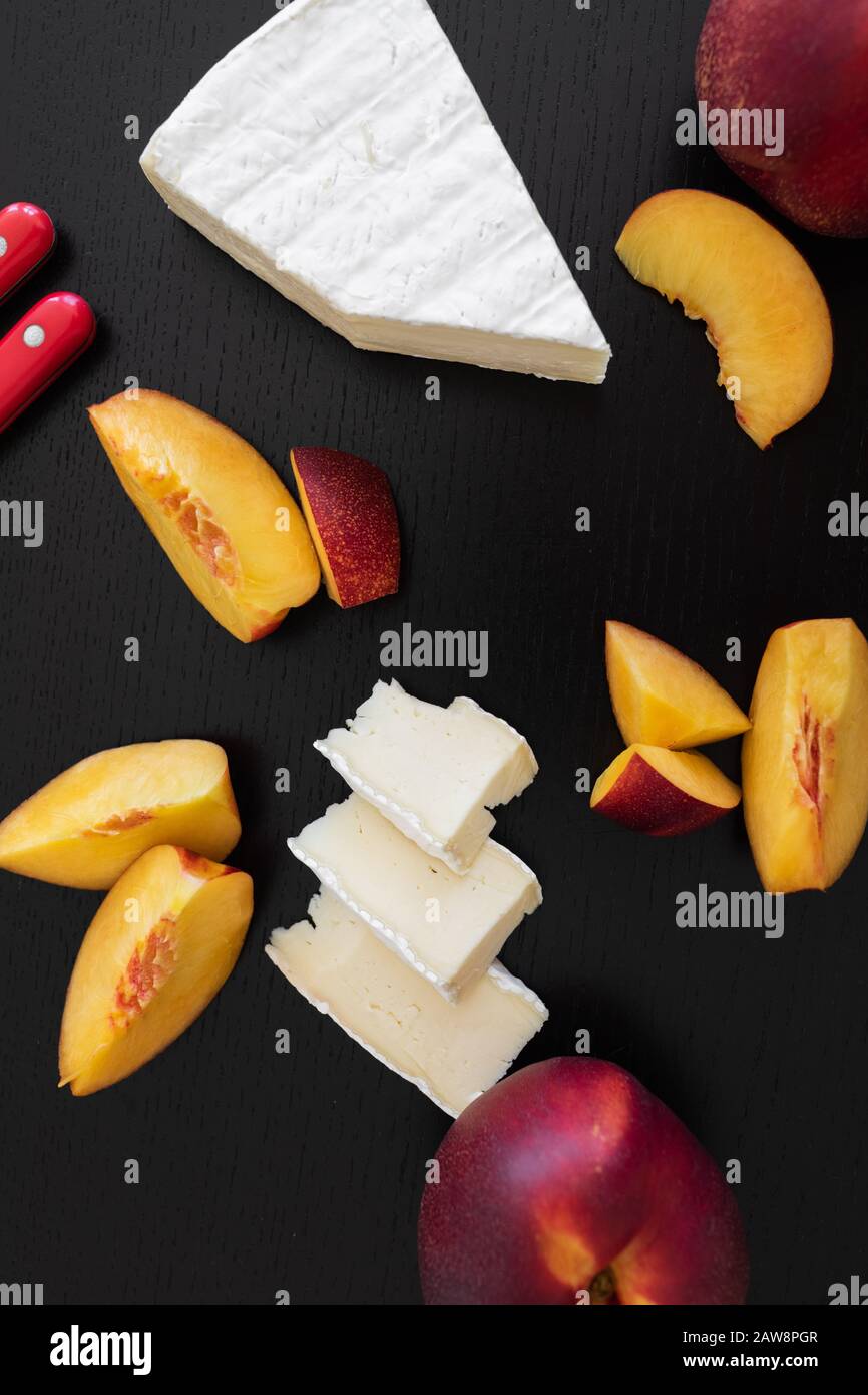 Combination of Brie french cheese and peach Stock Photo Alamy