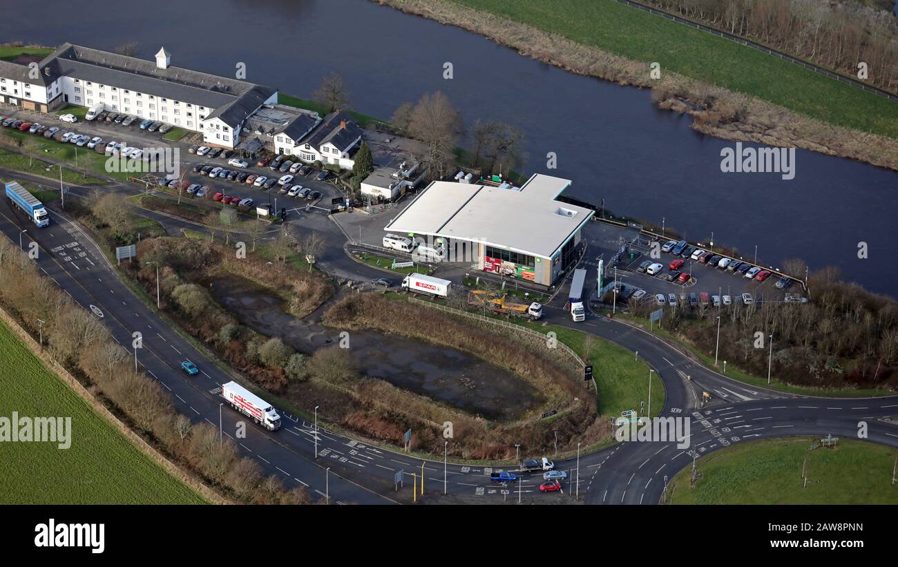 aerial view of a BP petrol station and Nisa Local Convenience Store next to The Tickled Trout Hotel on the A59 at Samlesbury, Lancashire Stock Photo