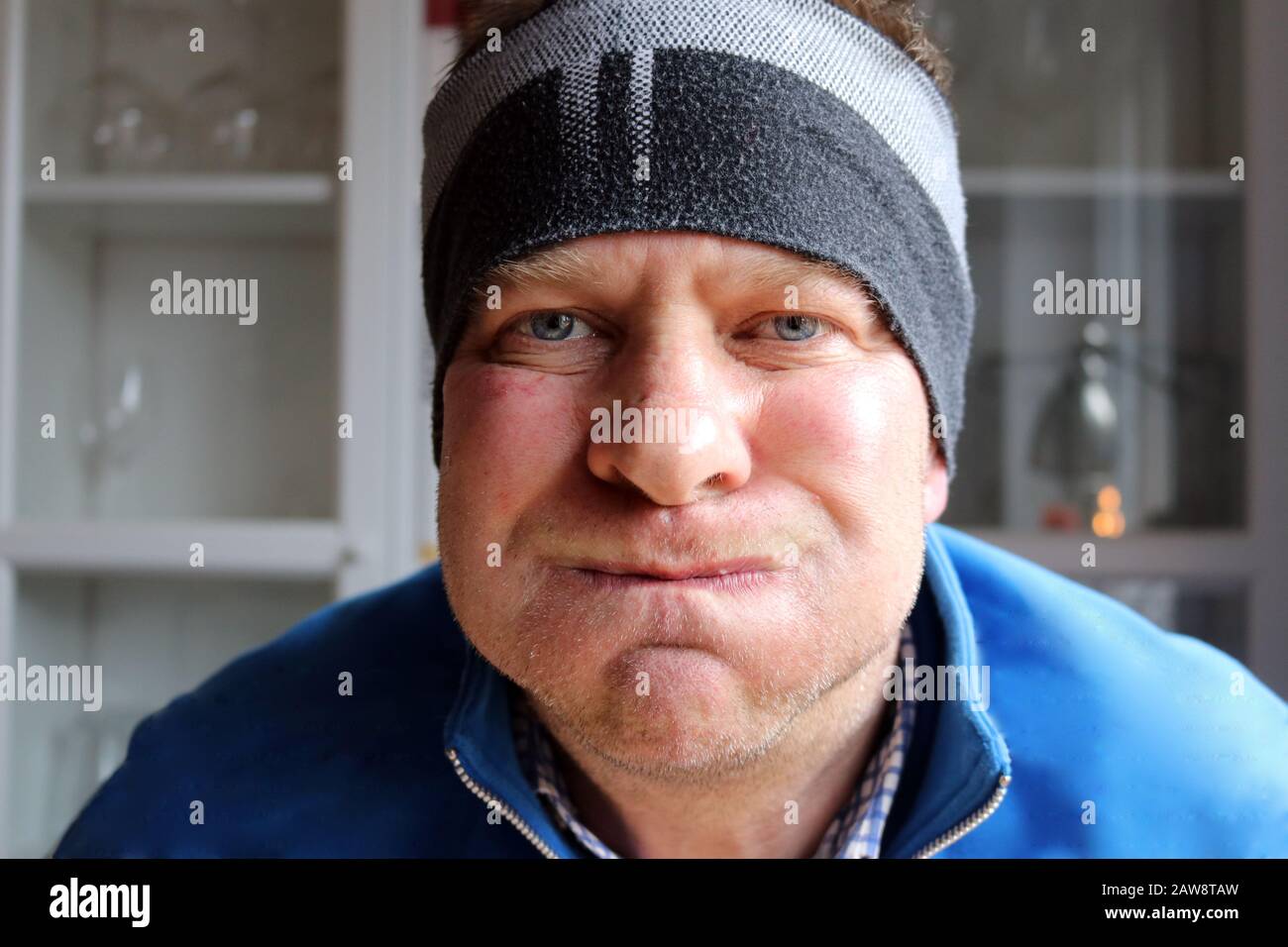 Funny face with puffed cheeks Stock Photo