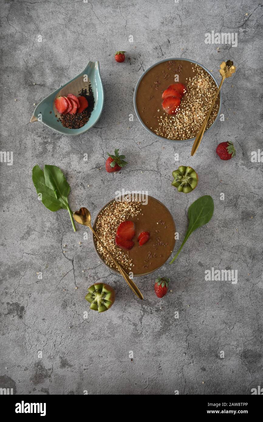 Chocolate strawberry smoothie in bowls. family, healthy, natural, organic, diet, food and drink, weight loss, nutrition, vegan, vegetarian, farming Stock Photo