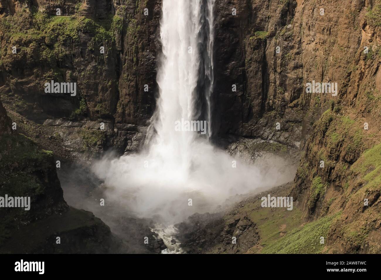 close-up of stunning waterfall running down a steap canyon Stock Photo