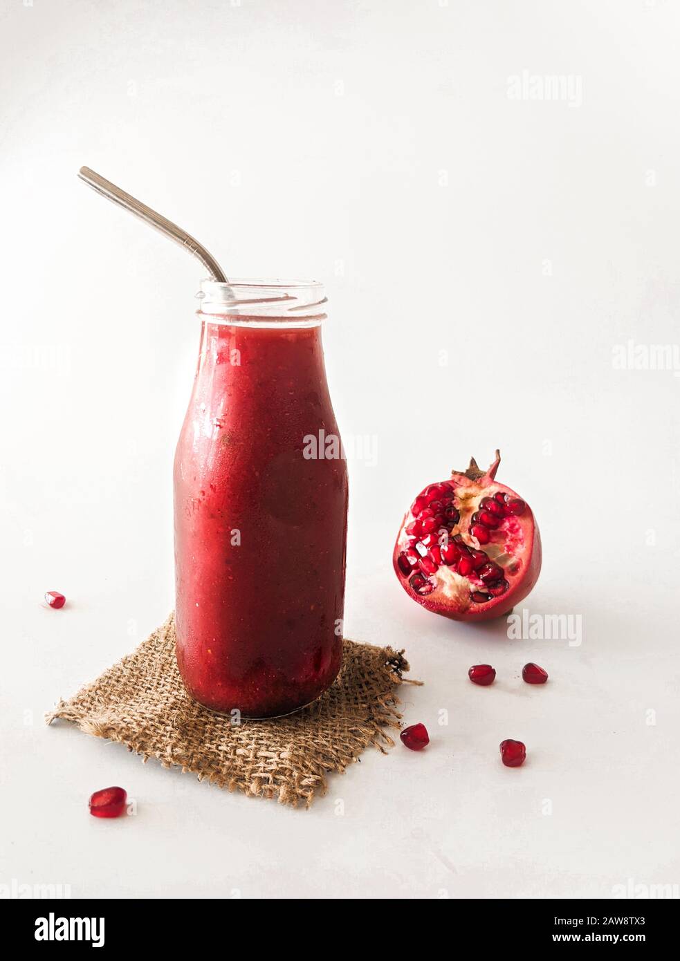 Pomegrenate Beetroot pink smoothie in a mason jar with, healthy, natural, organic diet food and drink, weight loss nutrition vegan vegetarian concepts Stock Photo