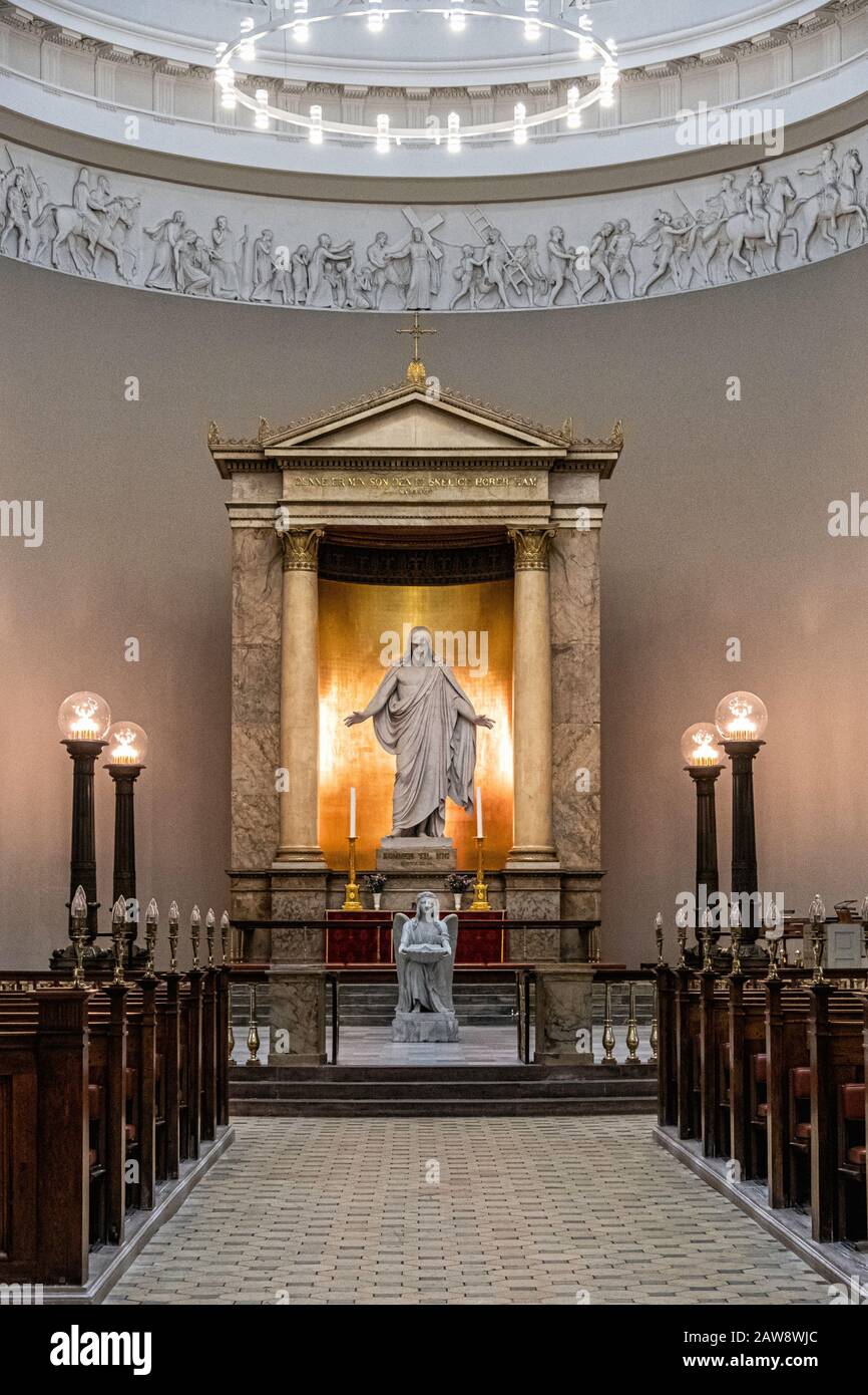 Copenhagen, Denmark. Church of Our Lady, Vor Frue Kirke Interior. Altar,Sculptures of Christ & Apostles,pews. Neoclassical style building Stock Photo