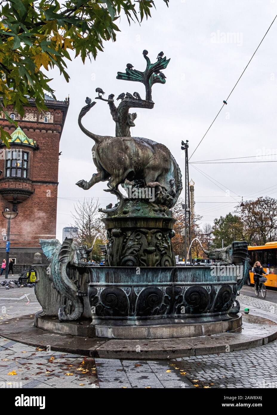 The Dragon Fountain 1904 with sculpture of bull and a dragon in combat  designed by Thorvald Bindesbøll and Joakim Skovgaard,  Rådhuspladse,Copenhagen Stock Photo - Alamy