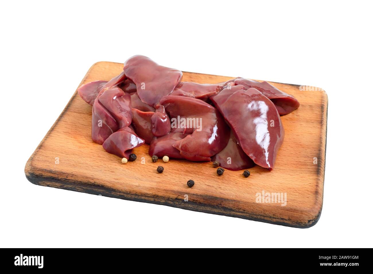 Raw chicken liver on a cutting board isolated on a white background. Offal. Ready to cook. Dishes from the liver. Stock Photo