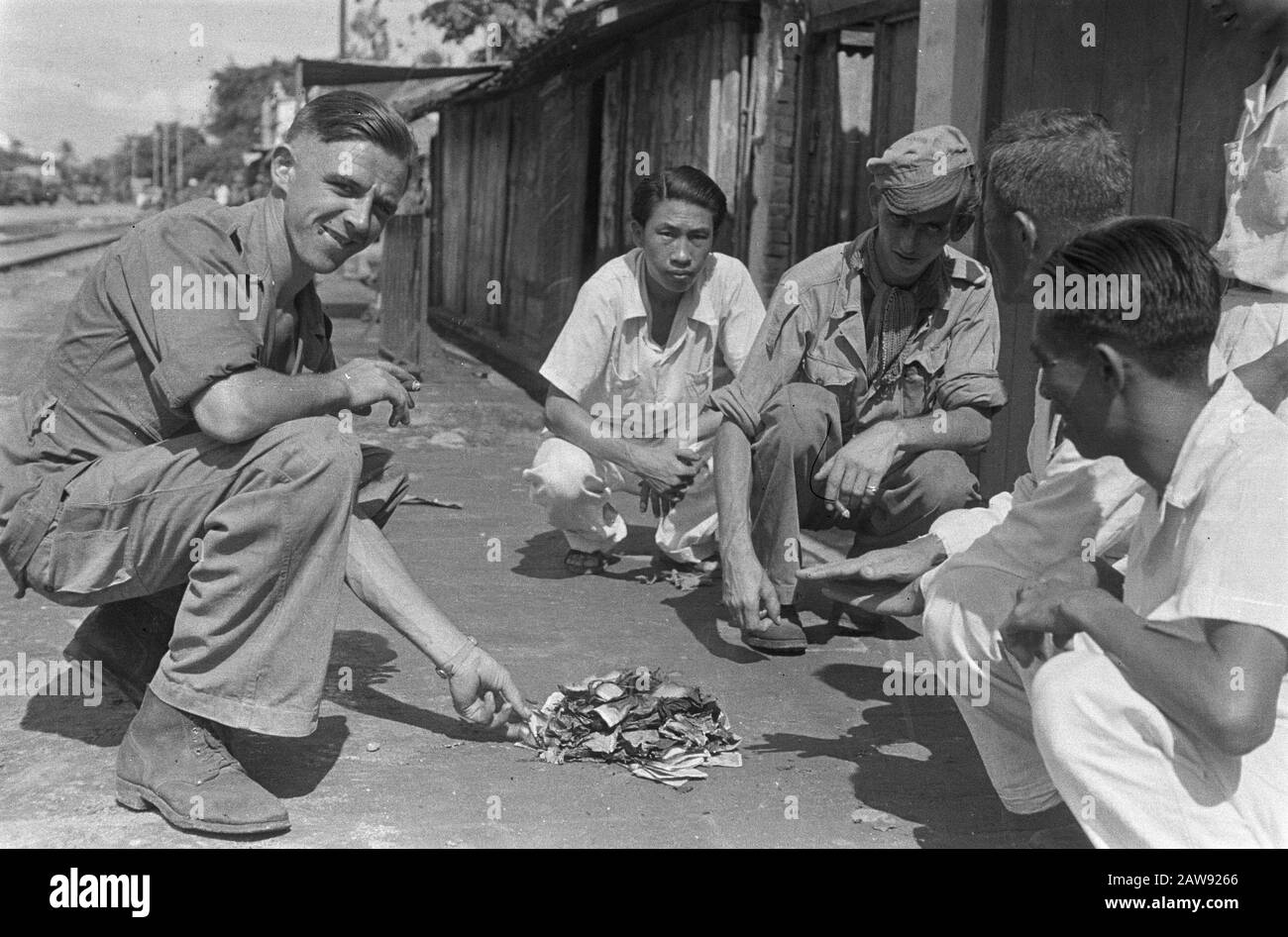 Rise of the V-brigade  Dutch soldier shows a pile of burnt documents Date: 12/01/1948 Location: Indonesia Dutch East Indies Stock Photo