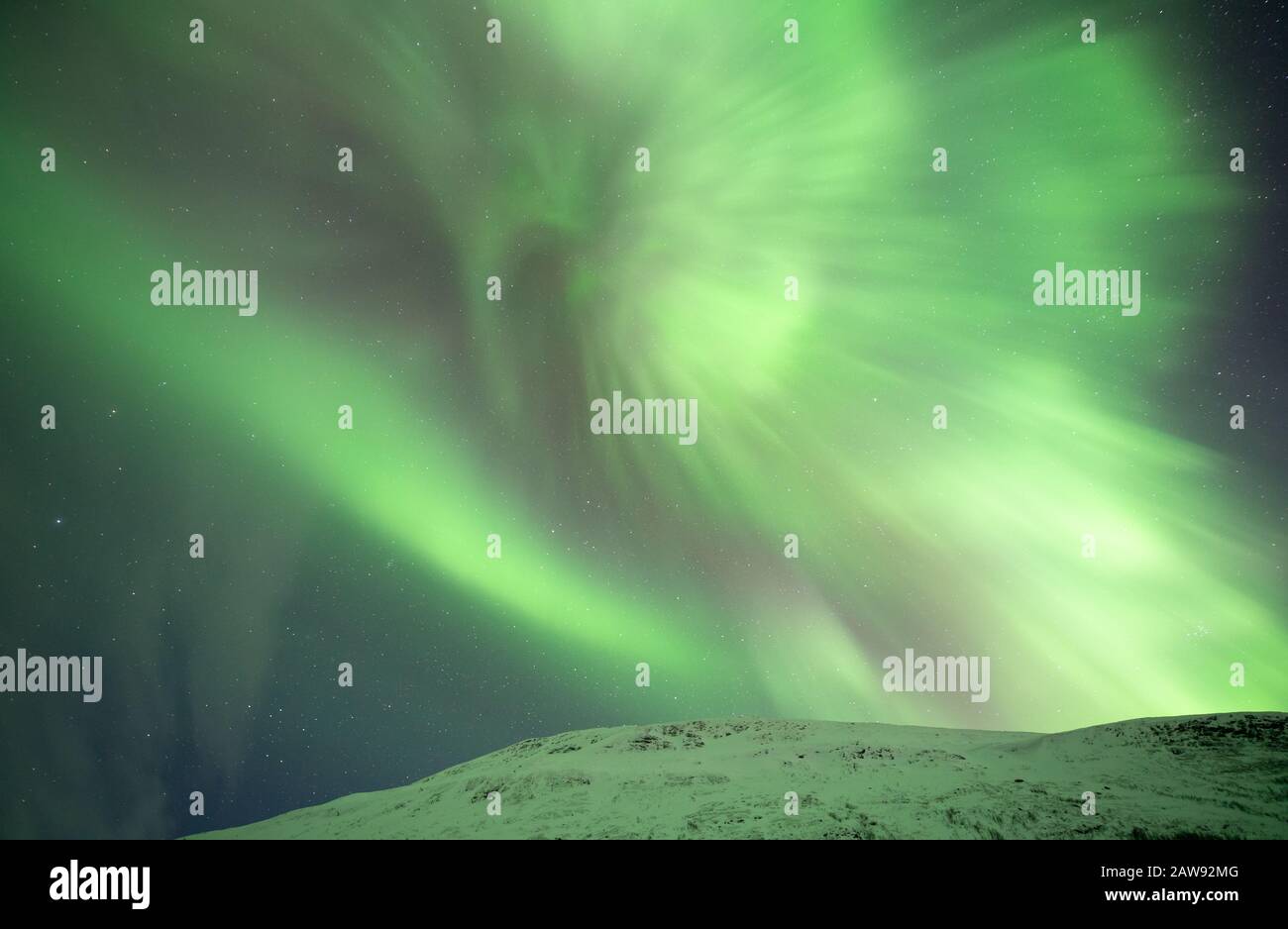 Northern lights over Abisko, frozen lake, snow and polar temperatures in Swedish Lapland Stock Photo