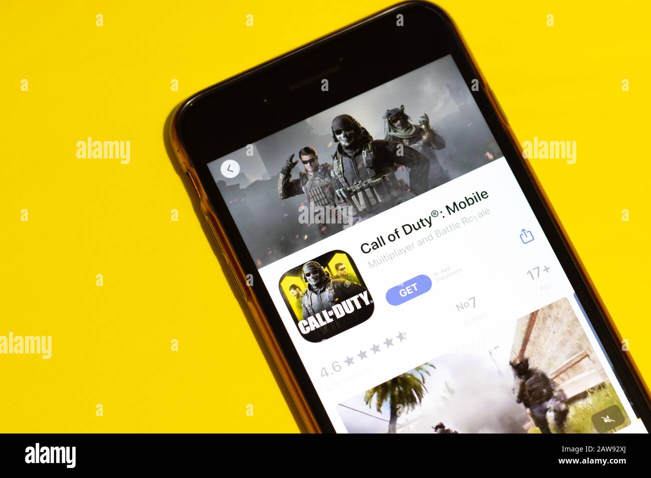 Los Angeles, California, USA - 25 January 2020: Logo of Call of Duty game mobile app on phone screen close up top view on yellow background Stock Photo