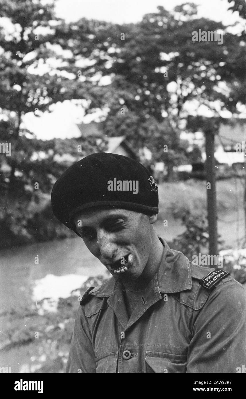 Military Service Military Contacts and Military Information Service attracts crazy heads with beret and denture Date: 01/01/1947 Location: Indonesia Dutch East Indies Stock Photo