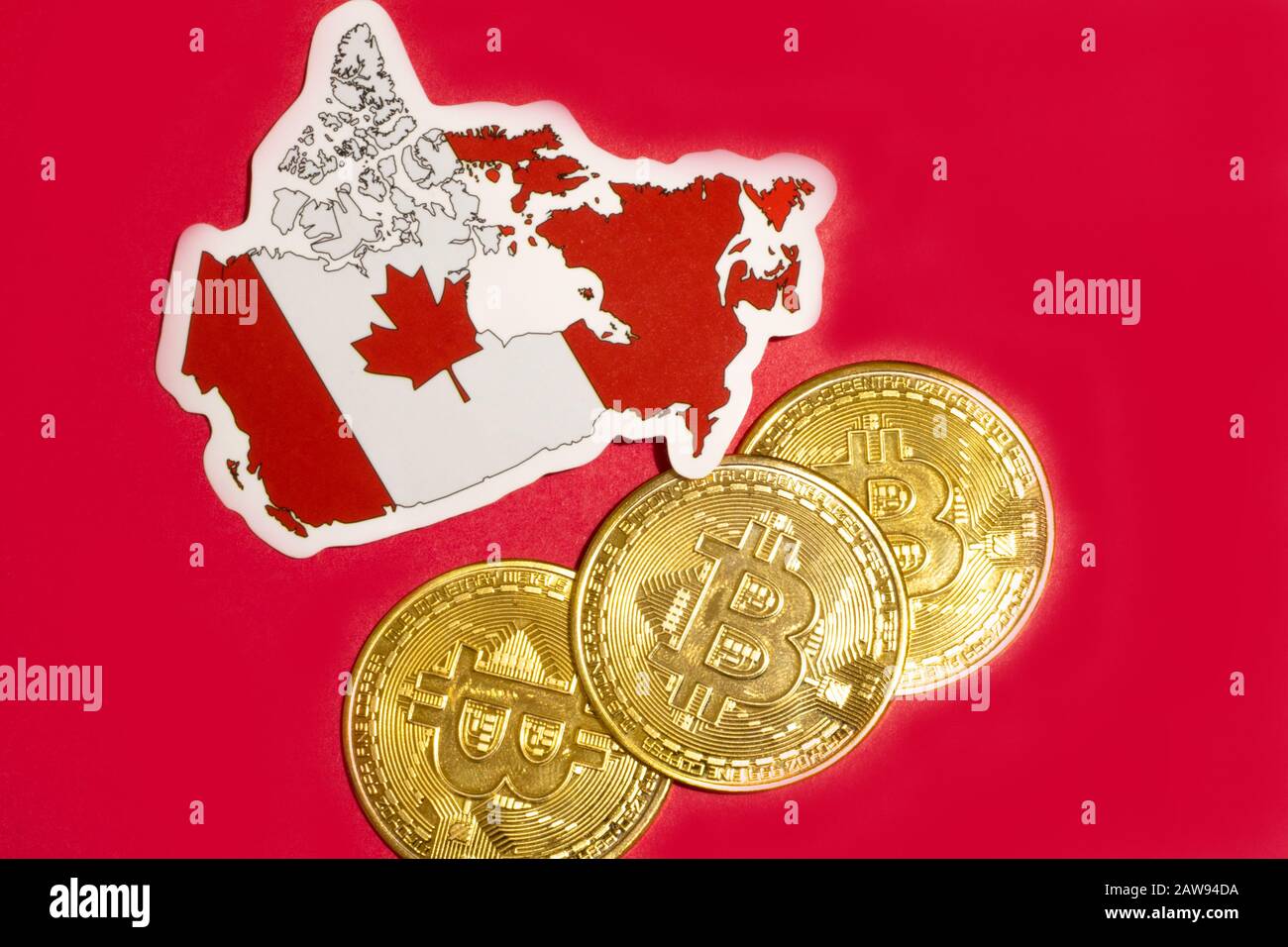 Canada Flag with Bitcoin flat lay for illustration. Cryptocurrency btc law concept Stock Photo