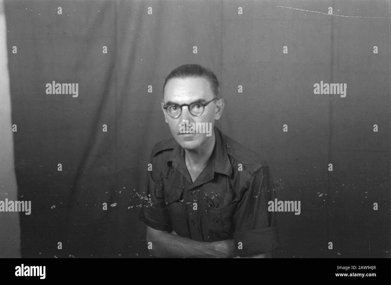 portrait images (miscellaneous) [passport photographs]  Man in uniform with dark glasses and mustache Date: 01/01/1947 Location: Indonesia, Dutch East Indies Stock Photo