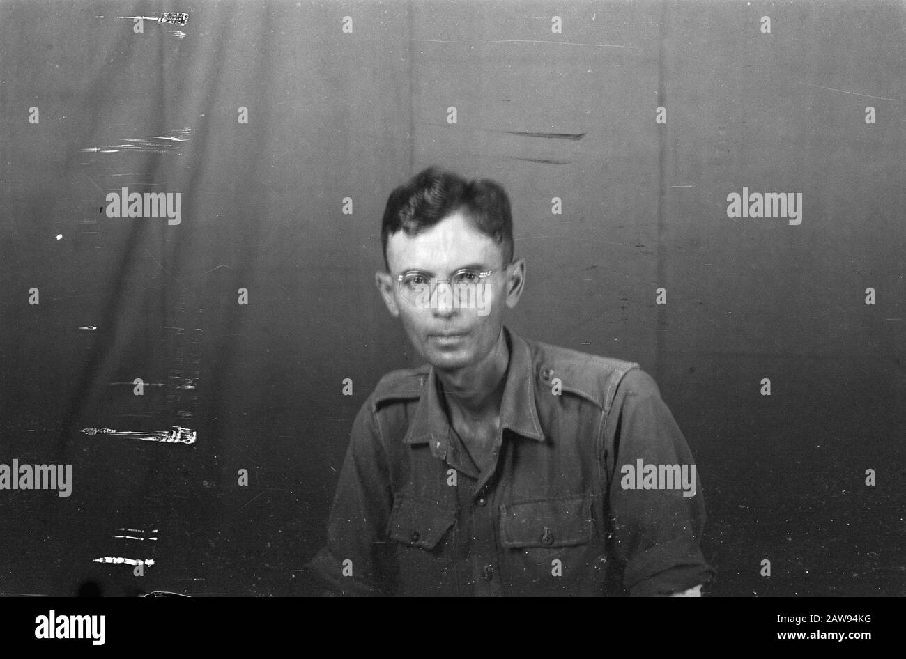 portrait images (miscellaneous) [passport photographs]  Dutch man in uniform with glasses Date: 01/01/1947 Location: Indonesia, Dutch India Stock Photo
