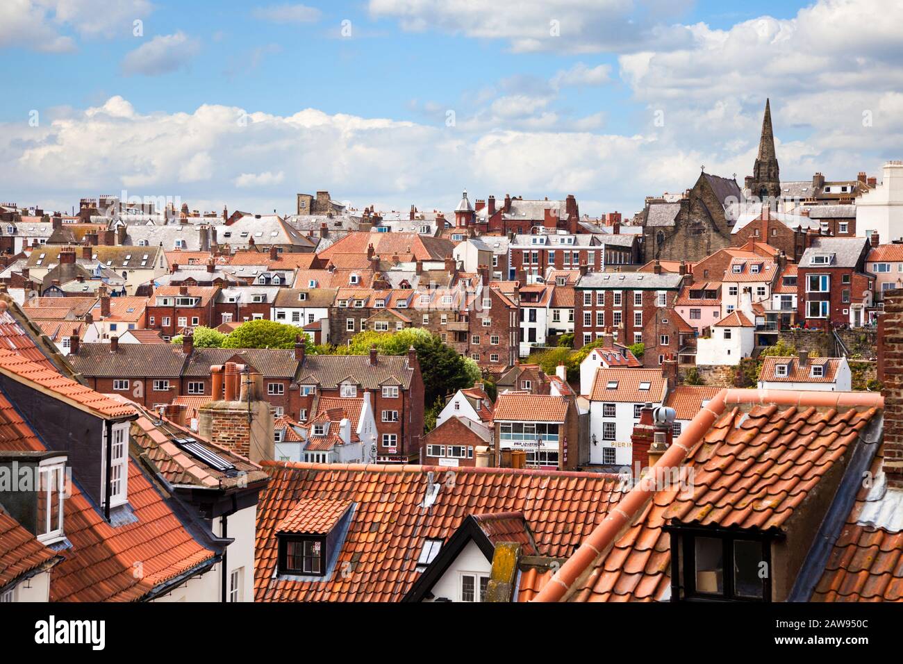 The red rooftops and skyline of Whitby, North Yorkshire, England UK Stock Photo