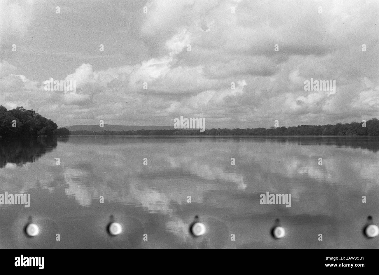 Landscape with broad river and cloudy sky Date: 01/01/1947 Location: Indonesia Dutch East Indies Stock Photo