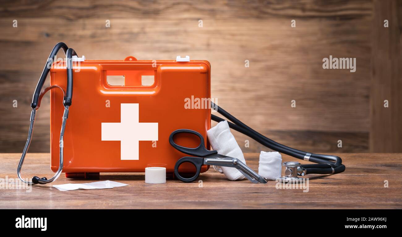 First Aid Kit With Medical Equipment On Wooden Background Stock Photo ...