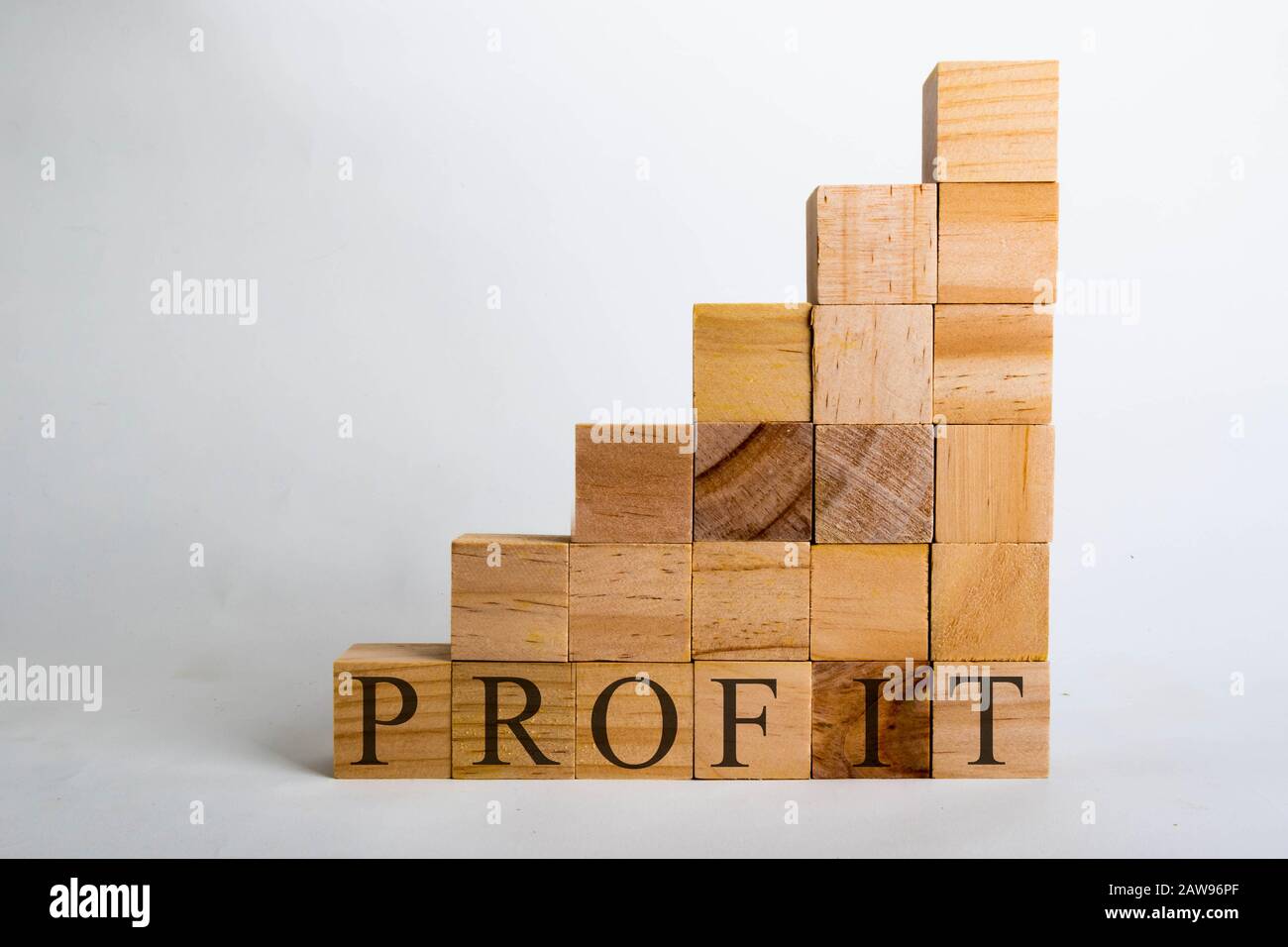 Wooden cubes with lettering spelling Profit shaped like a graph. Business concept Stock Photo