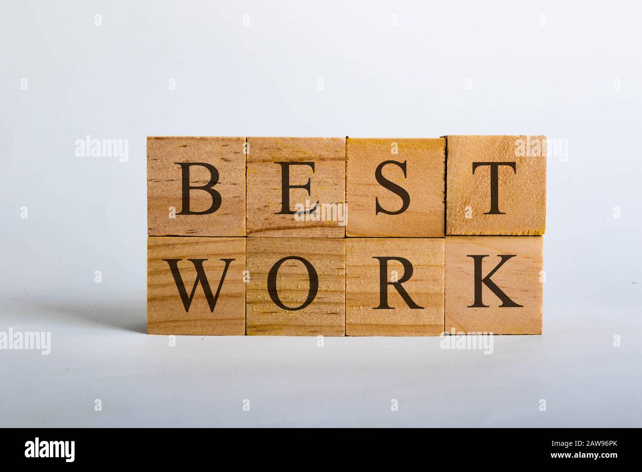 Wooden cubes with lettering spelling Best Work. Business concept Stock Photo